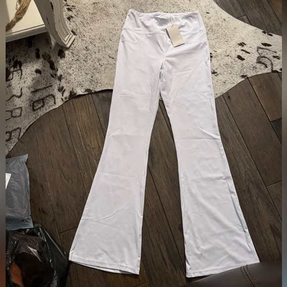 65. Halara High Waisted Back Pocket Flare Yoga Leggings in White - Picture 3 of 4